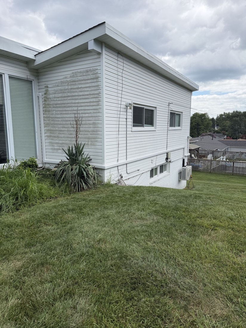 Exterior of a home with HVAC line set and equipment routing