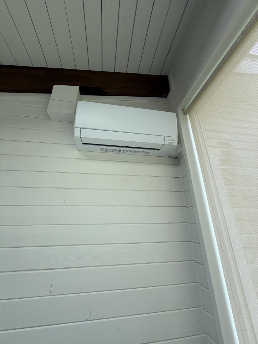 Mitsubishi Electric indoor wall-mounted mini-split unit on a screened porch